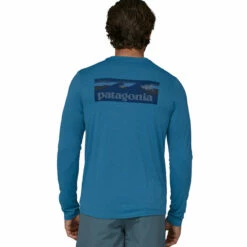 Patagonia Men's L/S Capilene Cool Daily Graphic Shirt - Waters - Boardshort Logo: Wavy Blue X-Dye 11 Patagonia Men's L/S Capilene Cool Daily Graphic Shirt - Waters - Boardshort Logo: Wavy Blue X-Dye -Brokedown Palace Shop Patagonia SS23 LSCapCoolGraphicWater BLWX 05